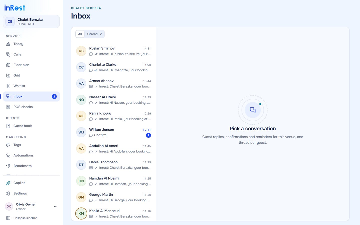 Inbox with WhatsApp threads per guest and one conversation open